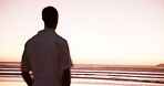 Back, man and thinking on beach outdoor in summer, planning travel and vacation memory. Male person, thoughts and peace with reflection ideas, calm morning and sunset view for holiday trip in Florida