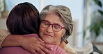 Hug, support and nurse with elderly woman for comfort, disease diagnosis or counselling for illness. Smile, advice and senior person in home with caregiver, embrace or help for empathy, love and hope