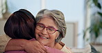 Hug, support and nurse with old woman for comfort, disease diagnosis or counselling for illness. Smile, elderly and senior person in home with caregiver, embrace or help for empathy, love and hope