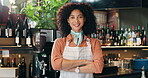 Barista, face and woman with arms crossed in restaurant for customer service, hospitality and career confidence. Waitress, african person and happy entrepreneur in bistro for small business and pride