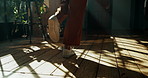 Walking, house and person with shoes, fashion or cool sneakers on wooden floor for back view. Ground, legs and feet with steps to travel on oak planks in house living room with footwear for journey