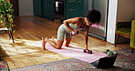 Woman, floor and dumbbells for fitness in home, laptop and streaming with online course in living room. Girl, bodybuilding and strong with weightlifting, computer and subscription at apartment