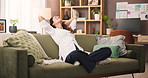Stretching, relax and woman on sofa in home for calm, peace and zen weekend in afternoon. Happy, stress free and female person in living room for wellness, health and break on holiday in apartment.