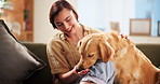 Woman, dog and happy on sofa with treats, feeding and reward for pet training in home. Girl, support animal and Labrador in living room with obedience lesson, care and smile for trust development