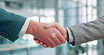 Closeup, handshake and welcome for hiring in office for business people, onboarding or recruitment. Human resources, manager and shaking hands with person, deal or b2b agreement for success at agency