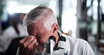 Scientist, man and microscope at laboratory with headache, tired and stress with sample in pharmaceutical research. Person, migraine and pain with clinical study for medicine, burnout and fatigue