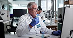 Samples, man and scientist with DNA in laboratory for discovery, study or project with research. RNA, science and mature male biologist with tubes for medical pathology for pharmaceutical innovation.