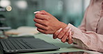 Wrist pain, office and business person on laptop with medical crisis, injury and accident. Professional, corporate and worker typing on keyboard with sprain, joint ache and hurt for carpal tunnel
