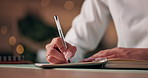 Hands, business and woman with notebook, night and planning with schedule, creativity and ideas. Writer, closeup and person in office, evening and journal for inspiration, novel and story with diary