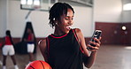 Basketball, phone and woman laugh at sports joke, meme or funny story at court. Smile, exercise and African person on mobile for online text, reading message or surprise with notification for fitness