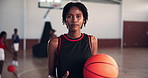 Basketball, confident and face of woman on court for training, exercise and workout in gymnasium. Fitness, athlete and portrait of sports person with ball for match, competition and practice for game