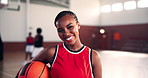 Basketball court, sports and face of woman with ball on for training, exercise and workout in gymnasium. Fitness, athlete and portrait of confident person for match, competition and practice for game