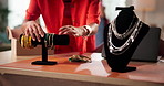 Jewelry, hands and small business with woman in office for designer, ecommerce and order. Online boutique, startup and dropshipping with person and necklace for inventory, logistics and entrepreneur