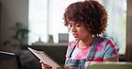 Confused, woman and reading document at house for mortgage mistake, payment error and financial fail. Person, laptop and review paperwork for balance report, banking loan and worry of investment debt