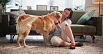 Relax, rub and woman with dog in living room in home for bonding, connection or companion. Happy, adoption and female person on floor with golden retriever pet for scratching animal, pet or puppy.