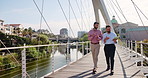 Tablet, discussion and business men on bridge in city with company budget planning in collaboration. Walking, digital technology and male financial managers with dividend account in urban town.