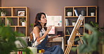 Woman, palette and artist with canvas in home studio with creativity, process and color for sketch with project. Person, painter and brush with stroke, drawing and design in living room at apartment