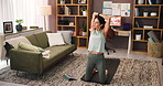 Yoga, woman and stretching arm in living room for body health, wellness or online class on tablet. Warm up, flexible or person practice pilates in home office to exercise, workout or fitness tutorial