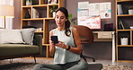 Cellphone, earphones and woman in home with music, playlist or album online for relax, calm and zen. Happy, dance and person streaming radio on mobile app with audio tech in living room at apartment.