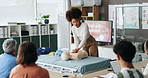 Woman, coach and first aid CPR with mannequin for emergency response, medical training or rescue class. Female person, instructor or paramedic trainer with demonstration for learning to save a life
