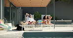 Sunbathing, relax and couple on vacation, sunglasses and people with domestic animal, resort and calm. Resting, man and woman with shades on holiday, luxury and comfortable on getaway or summer trip