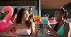 Women, friends and laughing with cheers at pool party for new year, celebration or summer vacation. Female people, drinks or cocktail with smile for break, relaxation or good vibes at luxury resort
