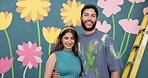 Face, smile and couple with painting on wall for mural art, creativity and decoration of community project. Portrait, people and embracing as artist, flower aesthetic and bonding for diy inspiration