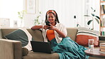 Laptop, phone and social media with black woman on sofa in living room of home for communication or streaming. App, computer and smile with happy person in apartment for text message on weekend