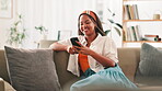 Smile, woman and rest with phone at house for communication, social media and reading blog. African person, happy and mobile app for texting feedback, weekend plans and message update of notification