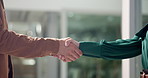 Business people, handshake and meeting with greeting for deal, agreement or teamwork at office. Closeup, employees or colleagues shaking hands in trust for partnership, b2b or collaboration together