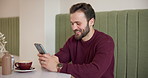 Man, laugh or mobile in cafe for social media, message or typing in texting app. Happy customer, coffee or phone in restaurant for connectivity, communication or scroll in comedy website for jokes