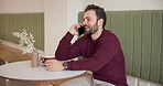 Man, phone call and smile for talk at cafe with contact, excited and discussion for deal on coffee break. Person, entrepreneur and smartphone for conversation, listen and networking at restaurant