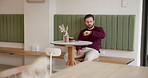 Man, check watch and cafe with worry for meeting, thinking and waiting for client with coffee cup. Person, time management and freelance business consultant with clock for schedule at restaurant