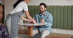 Man, waitress and coffee with smile at cafe with service, gratitude and chat on mobile app for contact. People, barista and woman with drink, smartphone and happy customer experience at restaurant