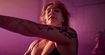 Dancer, sexy and club with woman in studio for burlesque, stage choreography and performance. Neon, pole dancing practice and sensual with person on floor for artist, fitness and confidence.