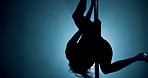 Woman, dancing and pole with silhouette at club, flexible and creativity with body, swivel or concert at night. Person, exotic dancer and balance for private show, performance or fantasy with mystery