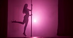Pole dancing, night and silhouette of woman in studio for burlesque, stage choreography and performance. Neon, dancer practice and sensual with person and light for artist, fitness and confidence