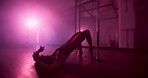Exotic, dancing and performance in club, flexible and dancer with balance for show, talent and artist. Night, active and person with elegance for event, pole and performer with outfit for routine
