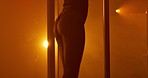 Pole dancing, buttock and neon with woman in club for exotic performance, light and burlesque. Stage choreography, artist and dancer with body of person for nightclub, entertainment and back
