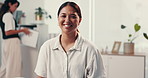 Happy, asian woman and face with doctor for checkup, hospital appointment or visit at clinic office. Portrait, female person or patient with smile for life insurance, healthcare or medical assistance