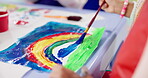 Hands, girl and painting art in classroom with creative lesson, drawing rainbow and kindergarten learning. Artist, student and picture with fun activity, artwork project and motor growth of education