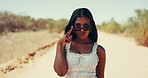Desert, sunglasses and road trip with woman outdoor for break, travel or vacation at sandy destination. Adventure, journey or smile and happy tourist person in nature with ball for getaway or holiday