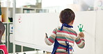 Child, student and art for painting handprint of creative lesson, self expression and kindergarten learning. Kid, identity canvas of fun activity, artwork project and motor growth of education memory