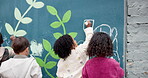 Education, mural and drawing with children and wall for friends, painting or community project. Flowers, learning and kindergarten street art with group of kids in city for volunteer outreach program