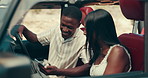 Cellphone, happy and couple in car for route, navigation or map to holiday home for vacation together. Love, romantic and man with woman on phone for online hotel checkin in vehicle for road trip.