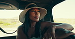 Road trip, passenger and woman with vehicle, hat and journey for vacation, weekend or break. Thinking, adventure and traveller with fashion ideas in car for summer holiday, safari tour or countryside