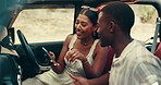 Couple, road trip and phone for direction, driving or search for location on digital map in countryside. People, woman and man with smartphone, discussion and happy on vacation with mobile app in car