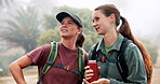 Conversation, backpacking and girl friends in nature for exploring, discovery or adventure. Discussion, coffee and women outdoor planning route for morning hiking or trekking together in forest.