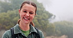 Face, hiking and happy woman outdoor for travel, adventure or holiday with fog. Smile, portrait and female person trekking in nature for trip, vacation or walk to explore forest on journey in Germany