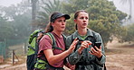 Hiking, friends and women with phone for direction, navigation and location on digital map. Mountain, nature and people on smartphone for online guide on adventure, journey and exercise for wellness